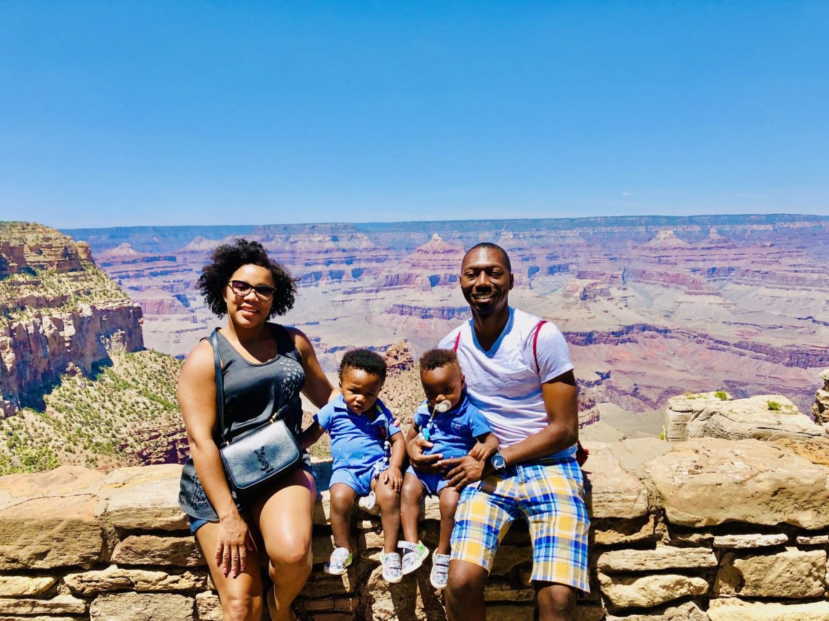Family Sitting at Grand Canyon