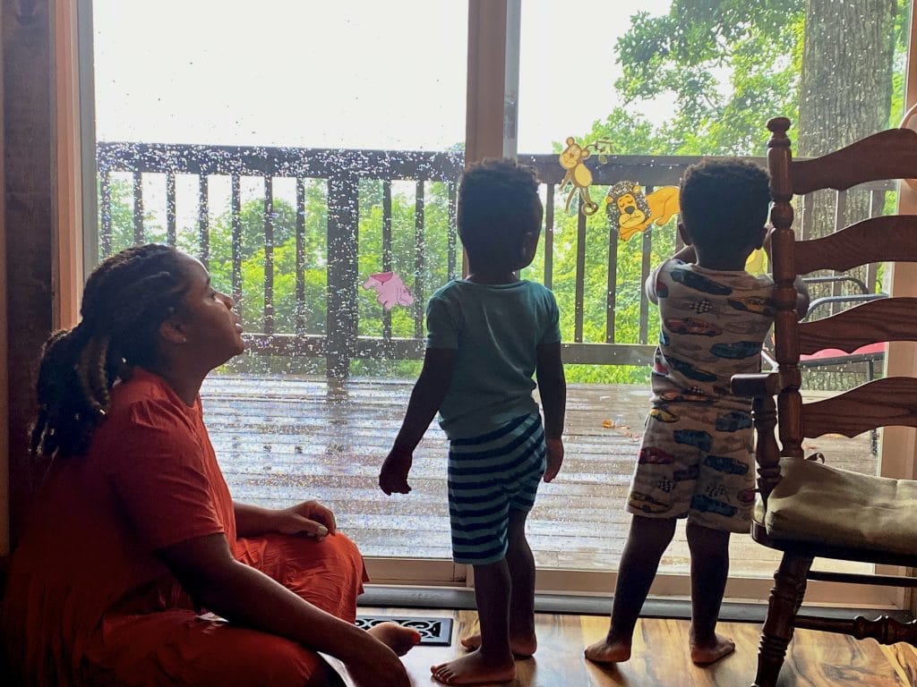 Kids playing with cling stickers on a rainy day during their Blue Ridge family vacation 