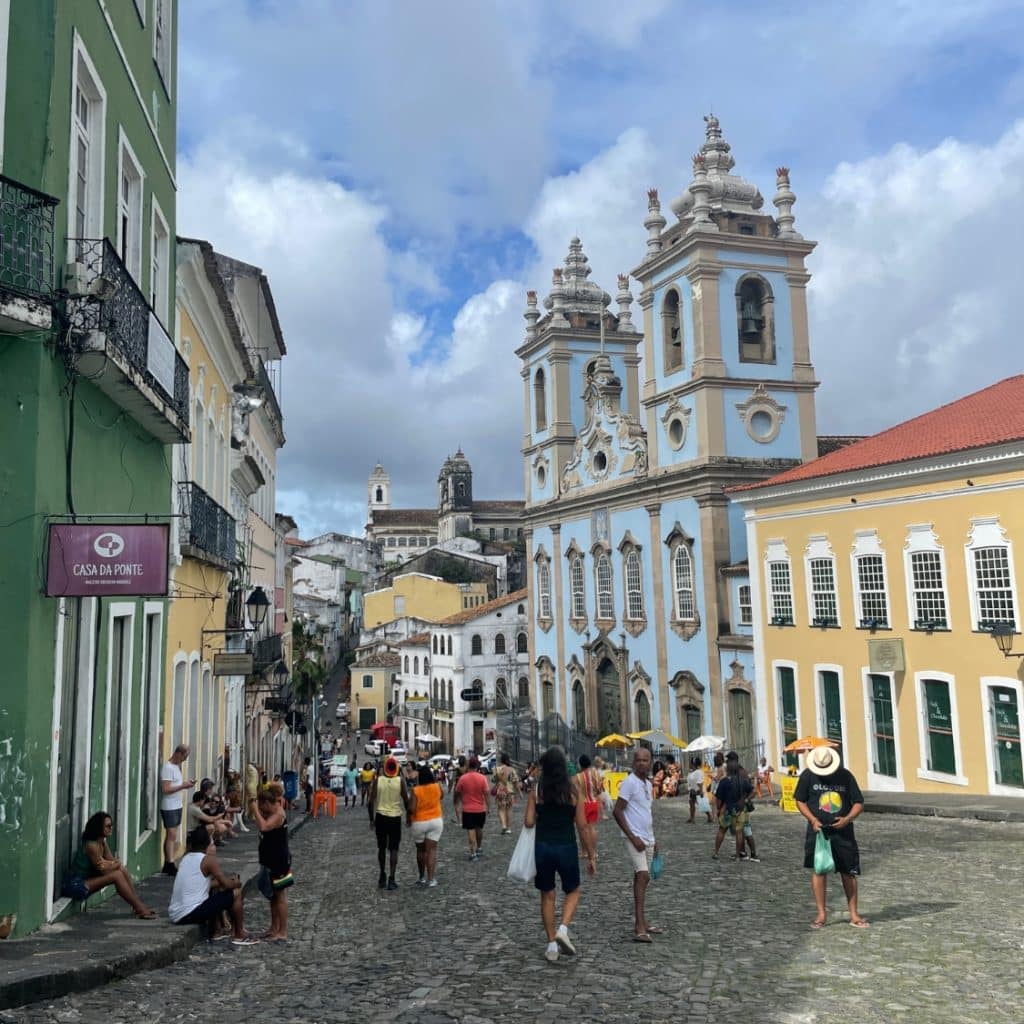 Tourist exploring the colorful buildings and cobblestone streets of Pelourinho in Salavdor, Brazil