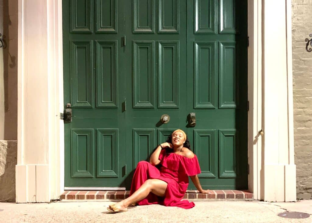 Me posing in a red dress in the French Quarter, New Orleans.