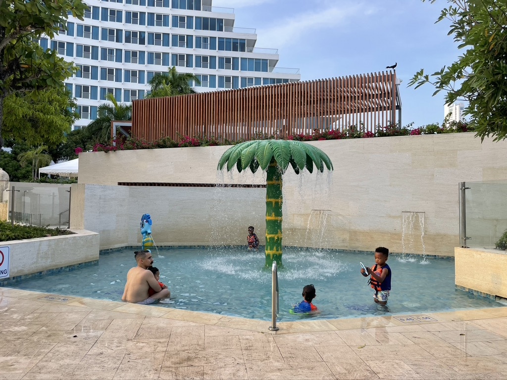 Kids playing in the kids's pool at Hilton Cartagena- a perfect Cartagena accommodations with kid