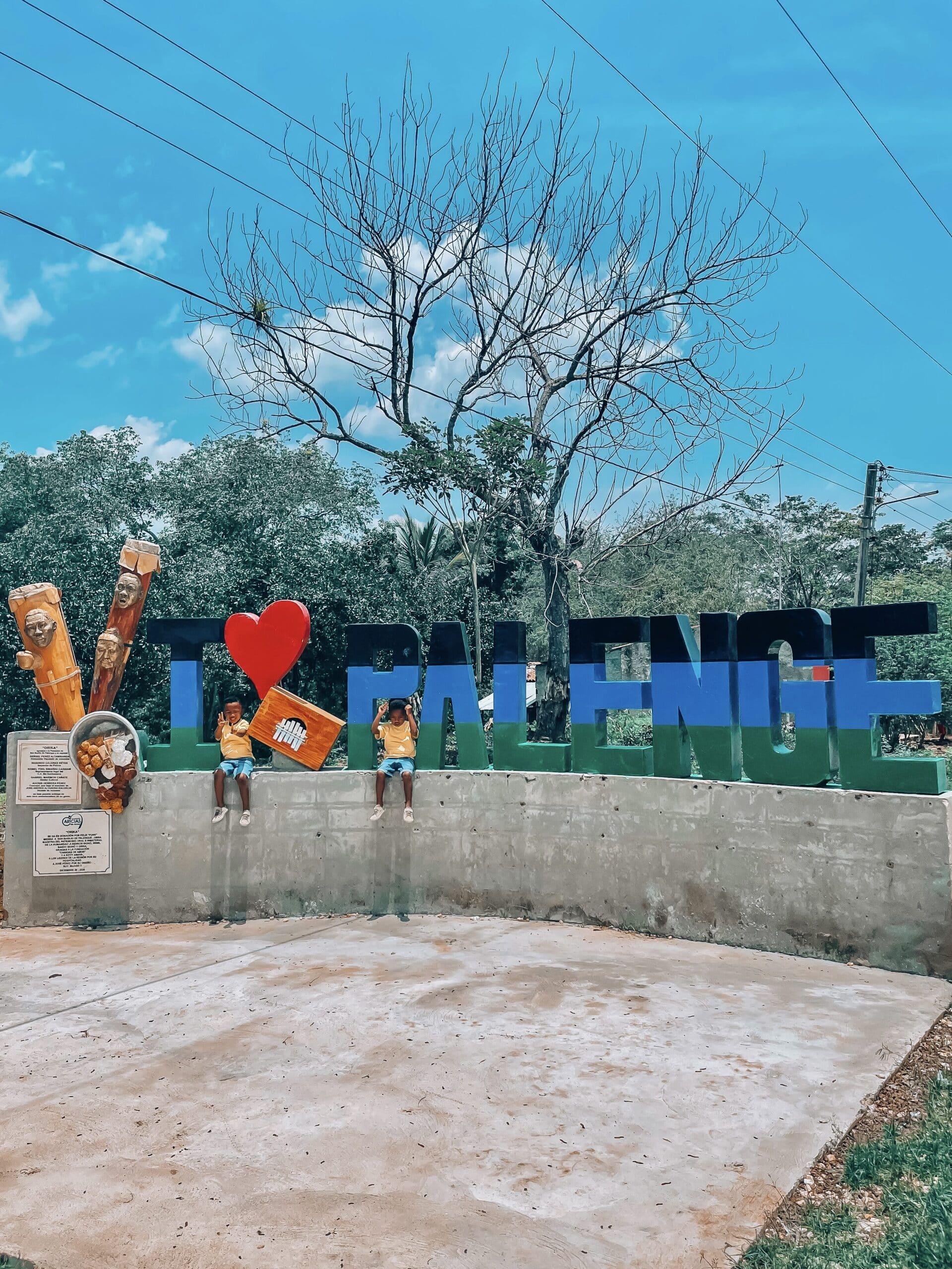 My twin boys posing in front of the I love Palenge sign- a great Cartagena activity with kids. 