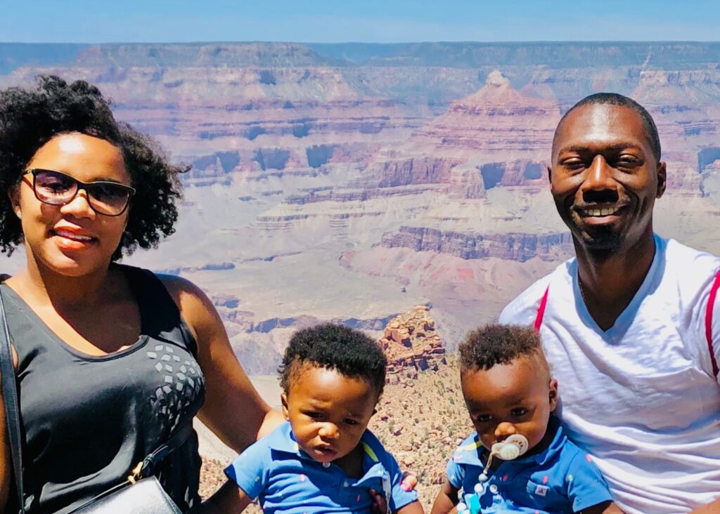 Our family on our Grand Canyon day trip from Sedona posing in front of the canyon. 