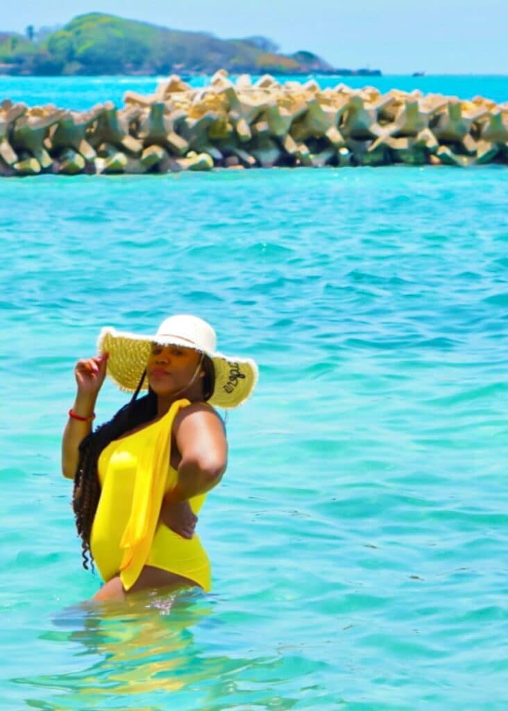 Wearing my Cartagena sun hat in the turquoise ocean. 