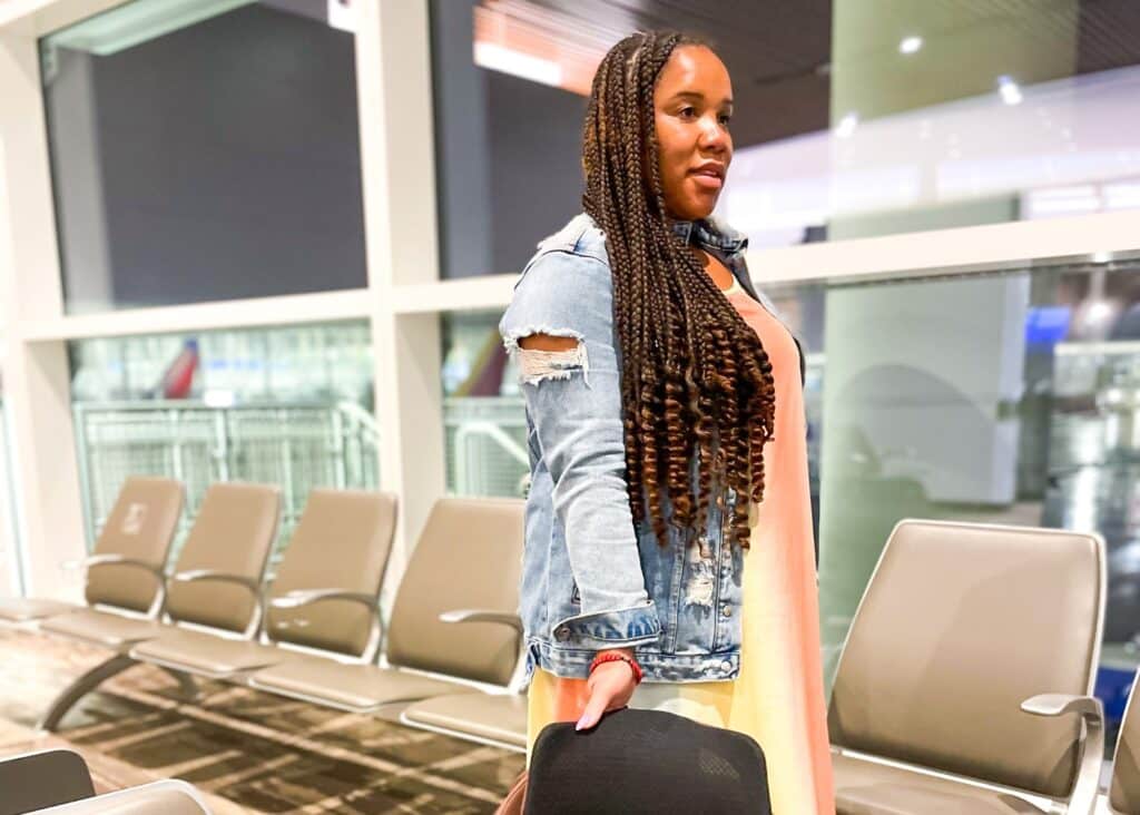 Me in the airport landing from my trip to Cartagena wearing a maxi dress and a jean jacket.