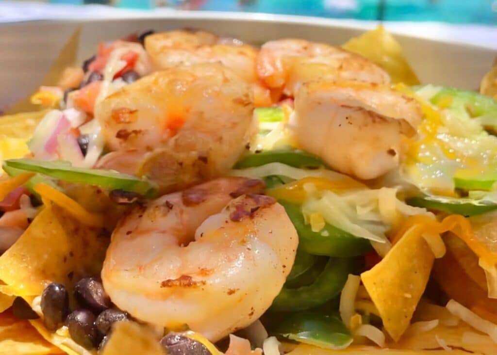 Shrimp nachos piled high with cheese, beans, and jalapeños at the San Juan Marriott Resort.