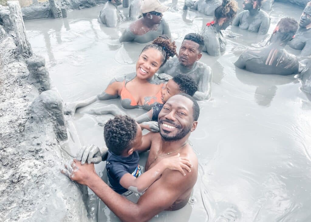 My family of 4 posing for a picture inside of the Cartagena Mud Bath