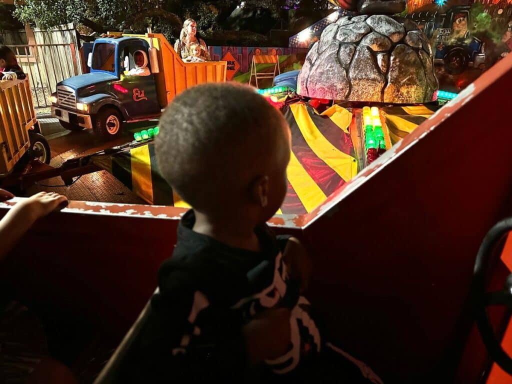 Boy on a ride at Ghost in the Oaks- a Halloween event at New Orleans city park