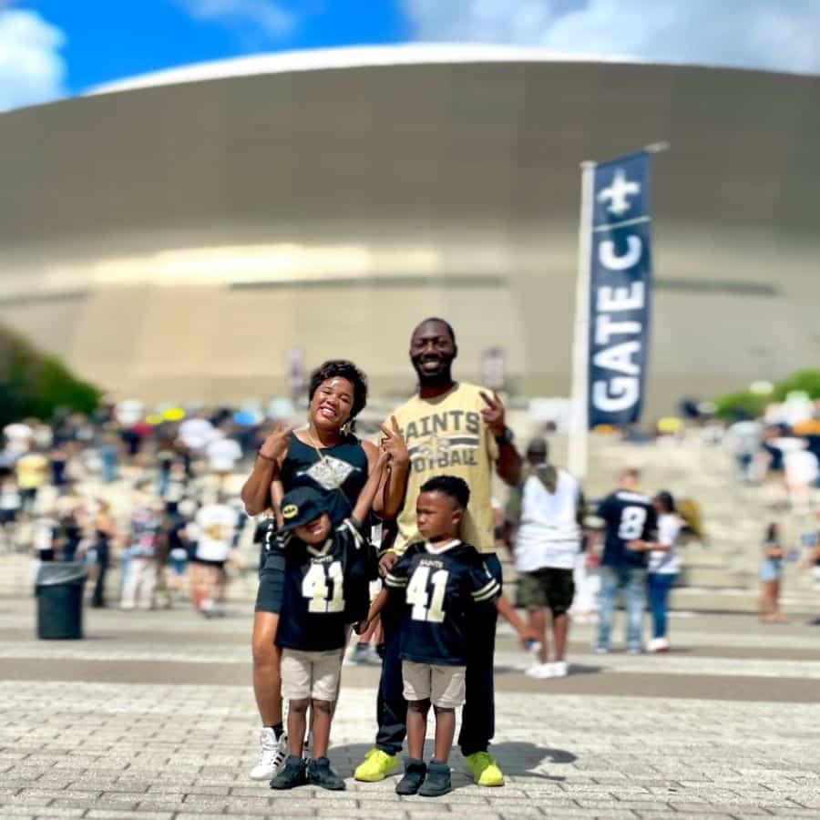 My family posing in front of the Superdome ready to enjoy a New Orleans Saints Football game in Fall