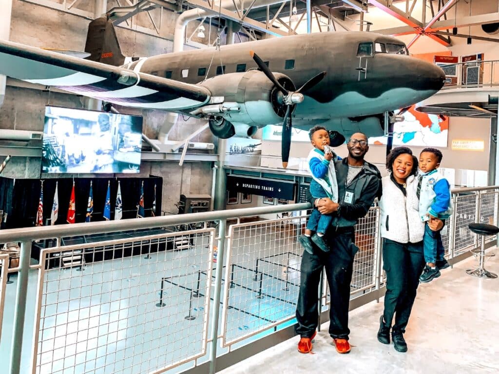 My family smiling on the 2nd floor of the World War II museum in New Orleans.